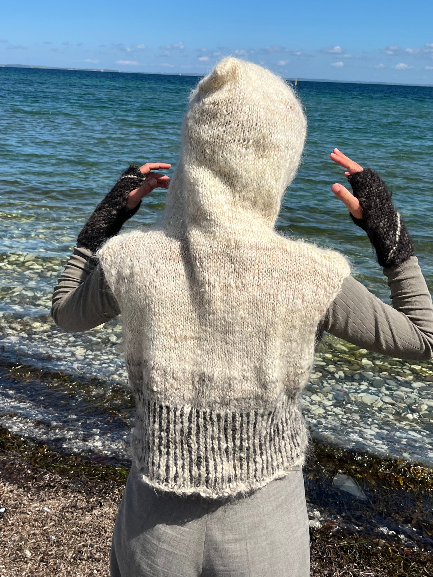 Dogma-knitted striped vest with hood